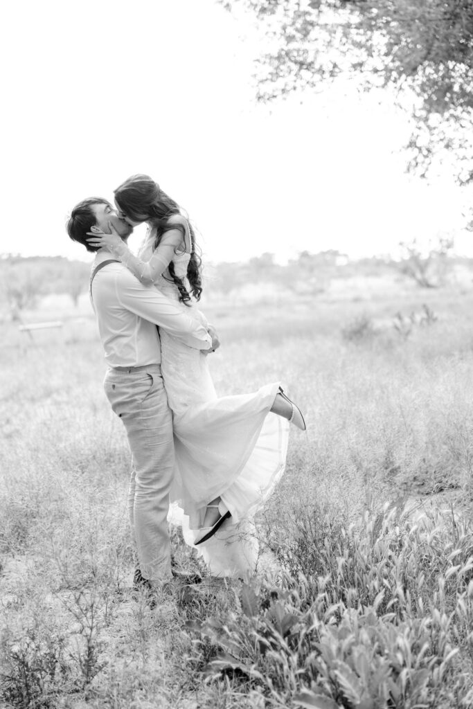 Black & white portrait of wedding day couple capturing the emotions of the day.