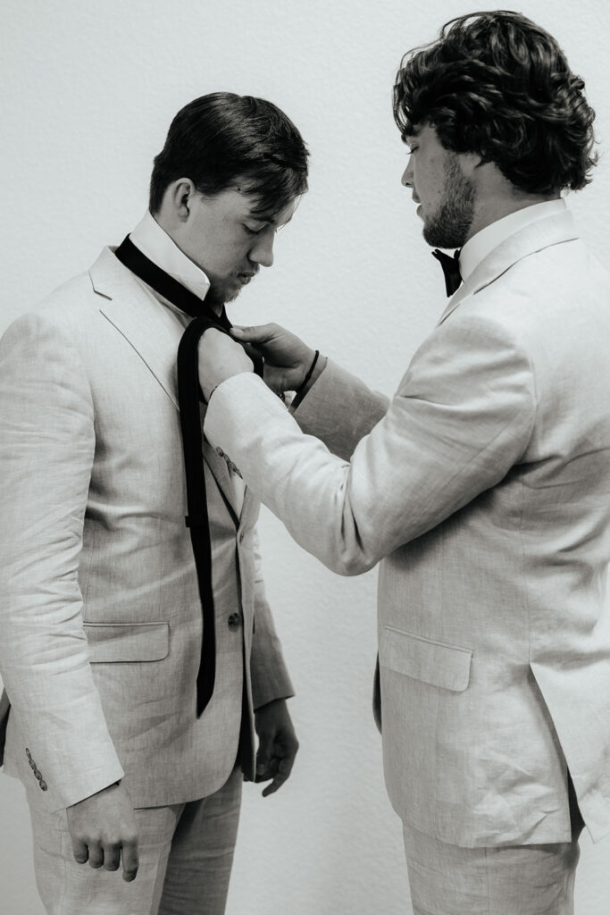 black and white wedding photo of groom in Texas