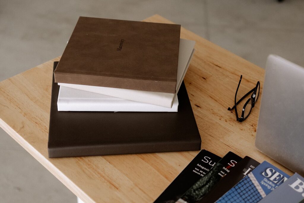 Mary Wiebe Lubbock Photography's photo albums on table

