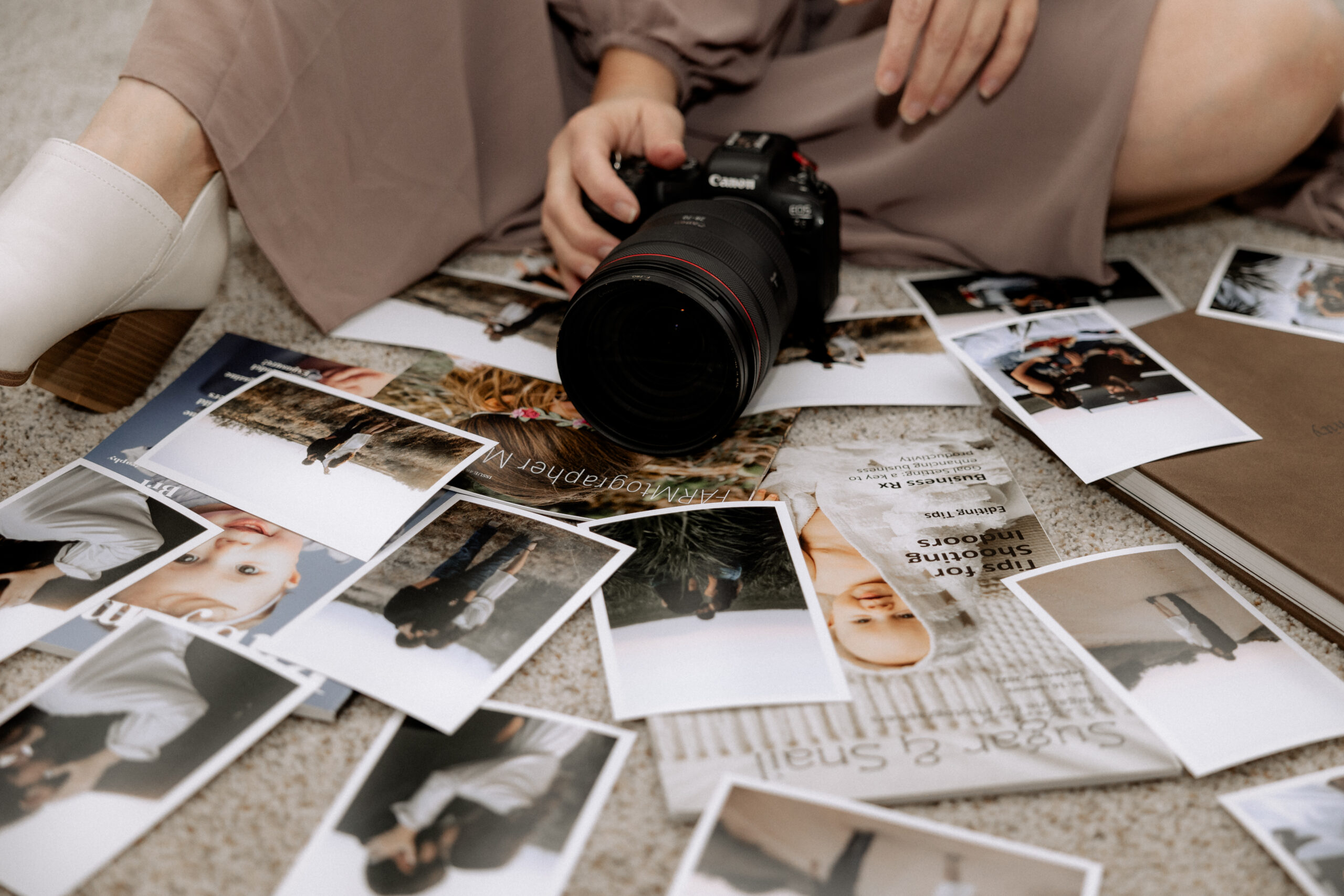 Mary Wiebe Lubbock Photography holding camera on top of her photos