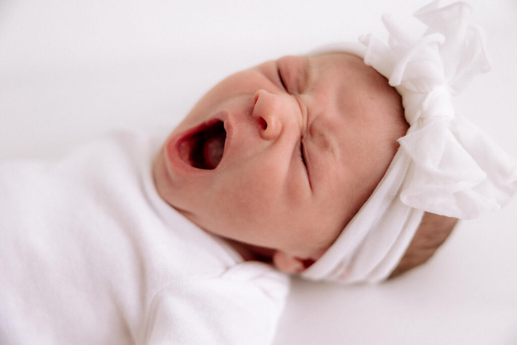 Baby yawning in Denver City Newborn Photographer Studio