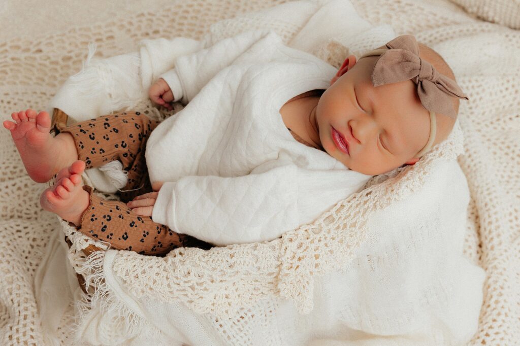 Mary Wiebe of Lubbock, TX captured this session of newborn in a basket filled with blankets. 