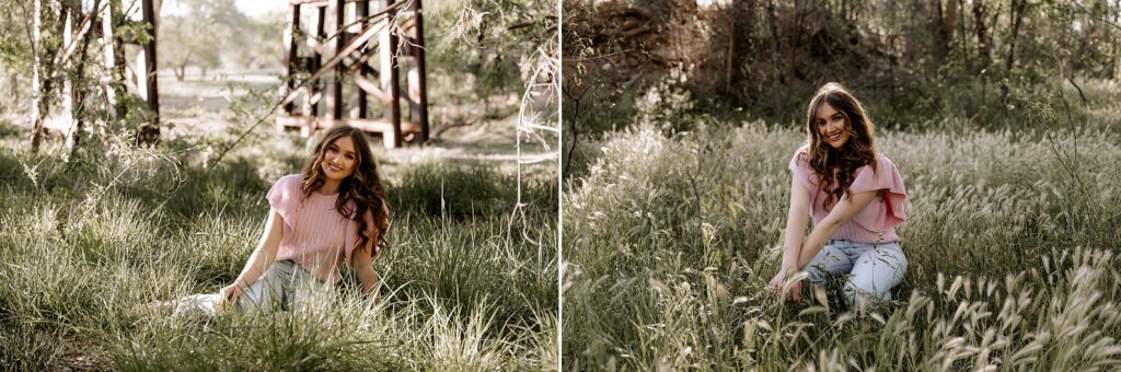 Sitting on the green grasses under a bridge is a senior girl at her senior photoshoot. Mary Wiebe Photography captured this image. 
