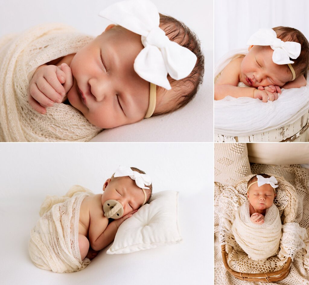 Newborn baby girl is swaddled up and laying in a wooden basket. 