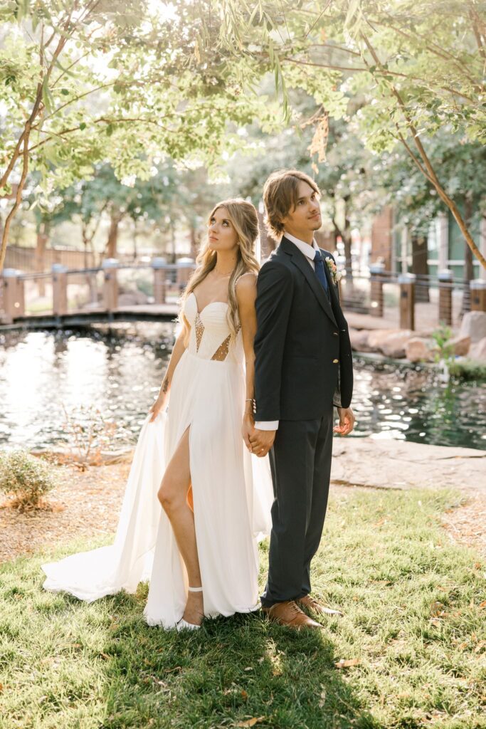 Stunning photo of the bride and groom, both are looking off in different directions for the photo.