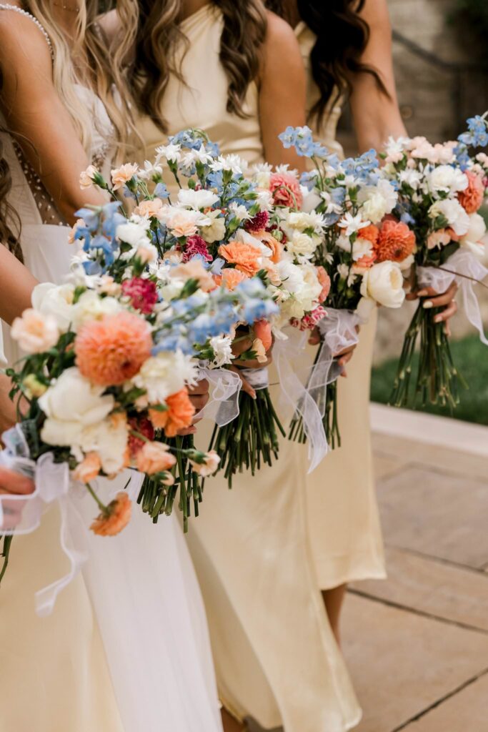 Photo of the bridal bouquets, flowers of orange, blue and white.