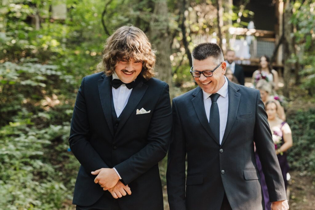 Pastor and Nathan walking down the aisle at Merrick Hollow Oklahoma wedding venue.