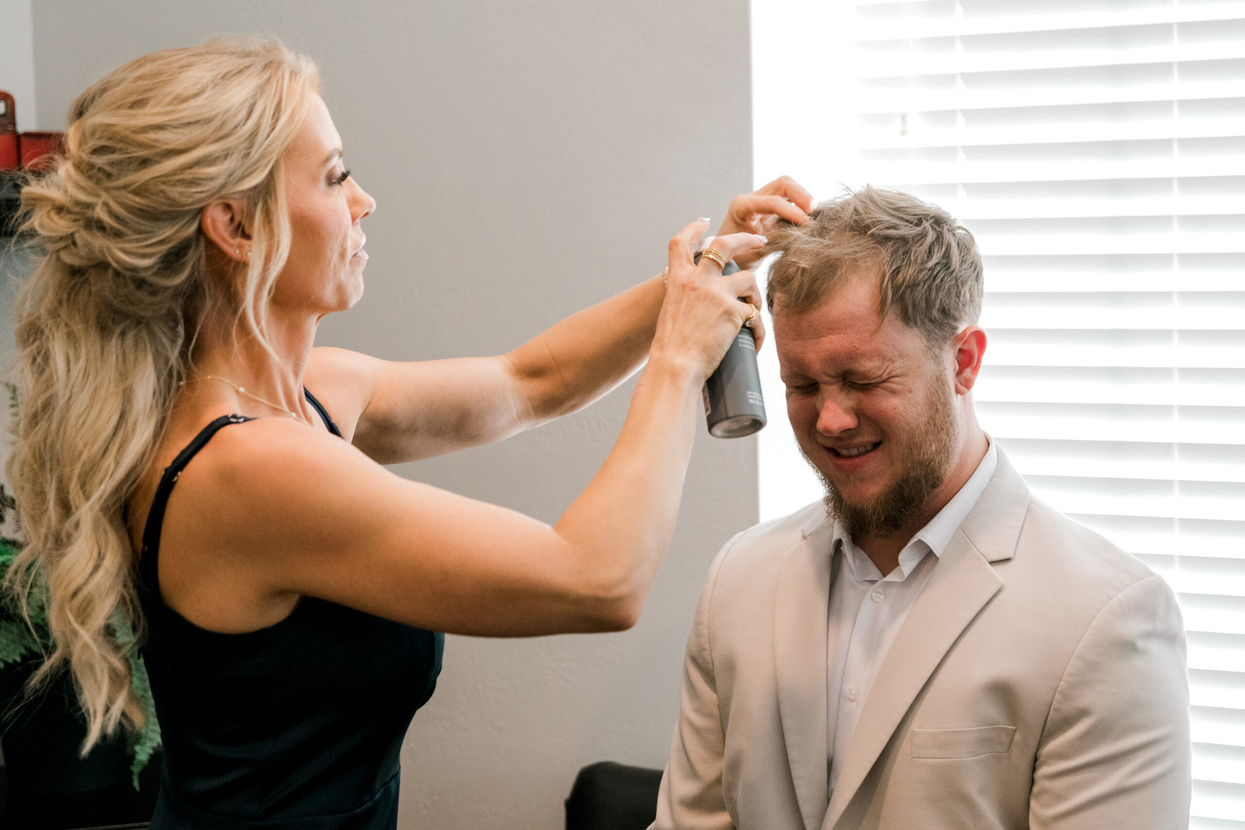 Groom getting his hair styled by his mom at Autumn Oaks, Lubbock, Texas
