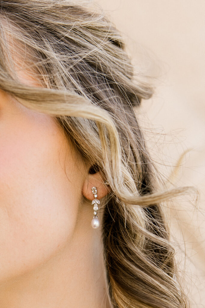 Detail shot of the brides earrings.