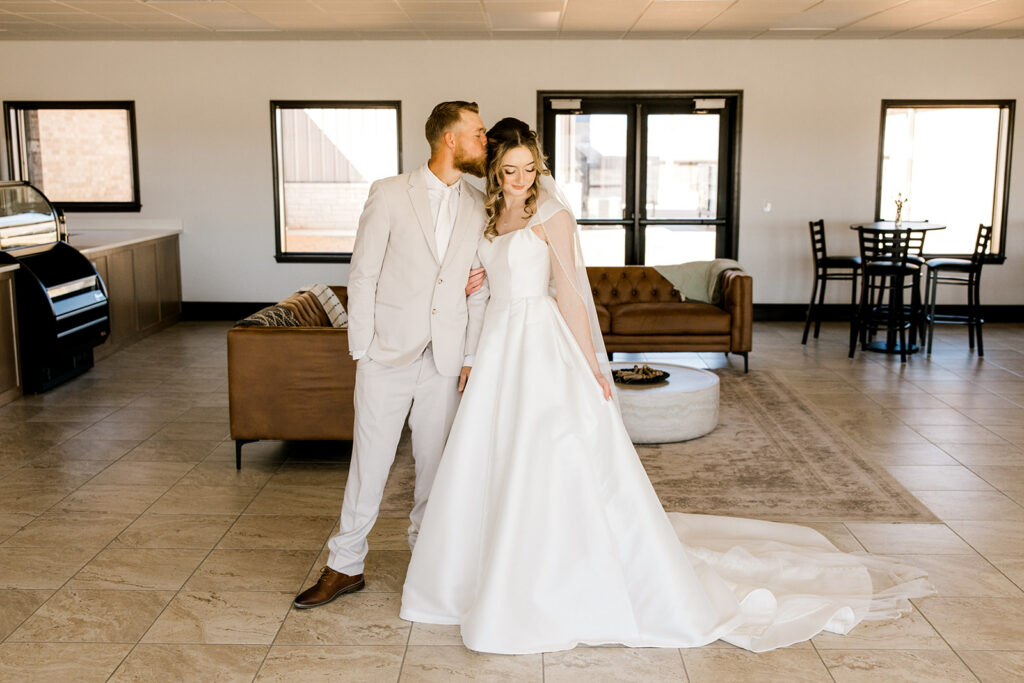 Goom kissing the bride.