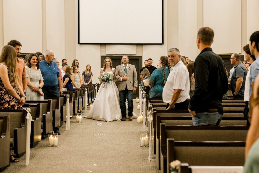 Bride and Father of the bride walking down the aisle.