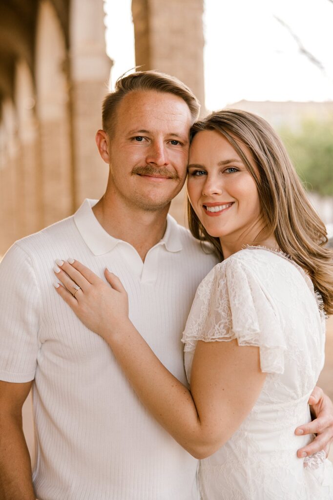 Couple portrait at the Texas Tech Campus. Her hand is laid on his chest during this portrait.