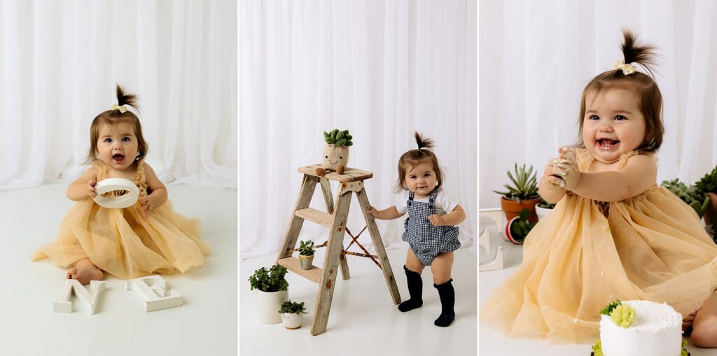 Baby girl is standing by a ladder with plants during this cake smash session for 1 year old photos. Mary Wiebe Photography captured this session.