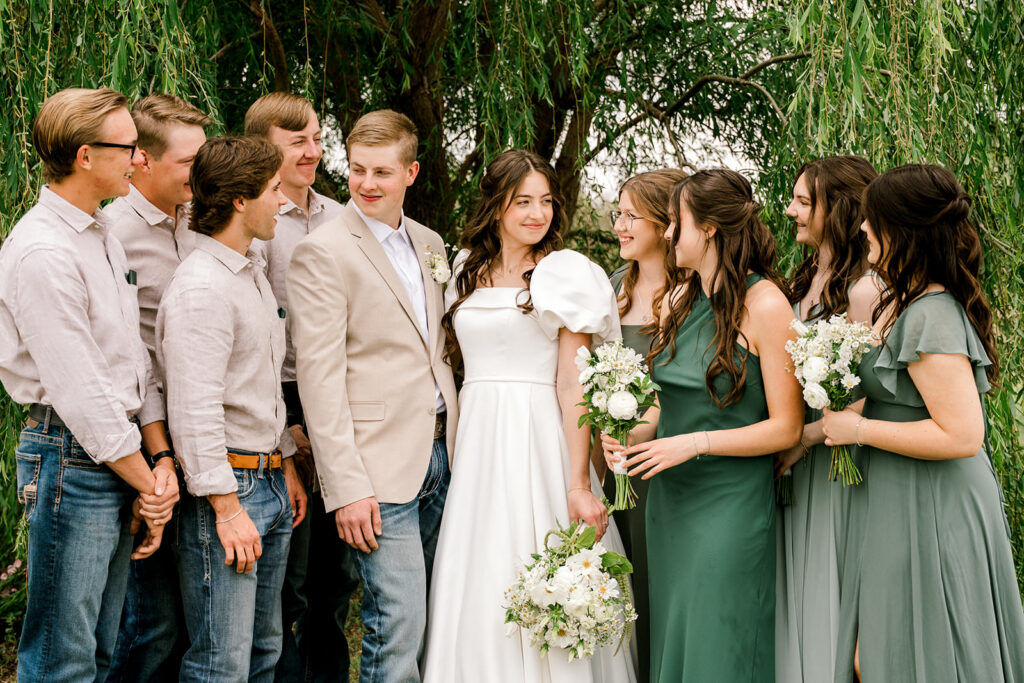 Hair and makeup artists for Texas wedding can be a challenge to find. Here is a bridal party standing in front of trees with their hair and makeup done by one of my favorite artists. Captured by Mary Wiebe Photography.