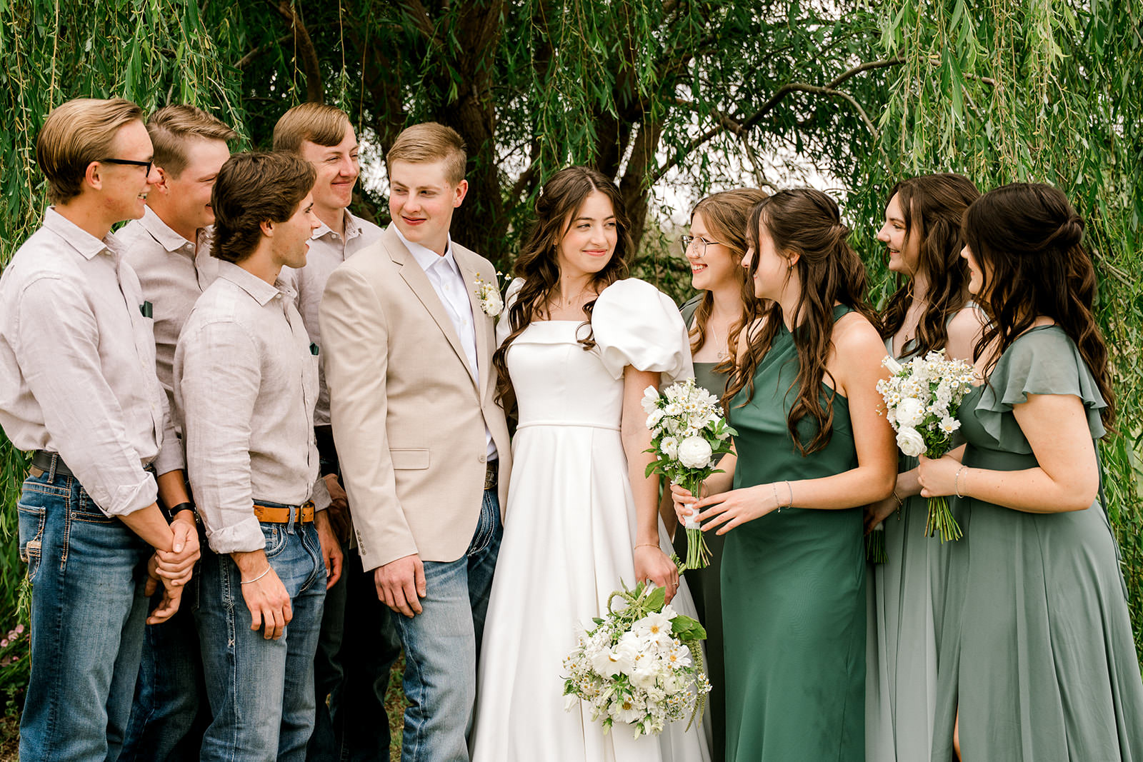 Hair and makeup artists for Texas wedding can be a challenge to find. Here is a bridal party standing in front of trees with their hair and makeup done by one of my favorite artists. Captured by Mary Wiebe Photography.