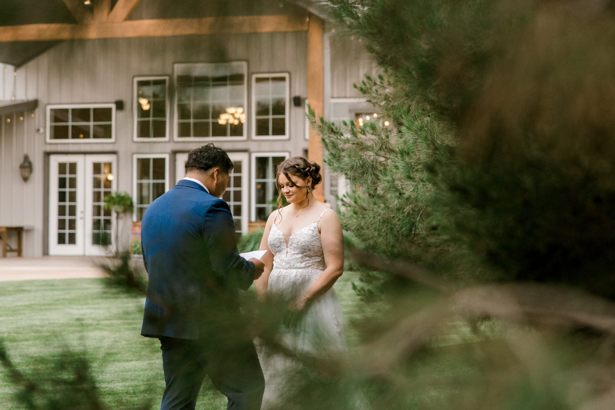 Choosing the best wedding photographer in texas can seem challenging, but anymore. Here Mary Wiebe Photography captured this bride and groom through a set of trees for the private vows.