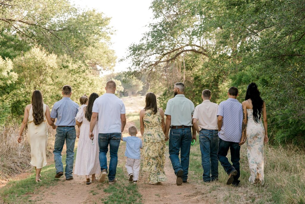 Extended family photo where they are all walking away from the camera.