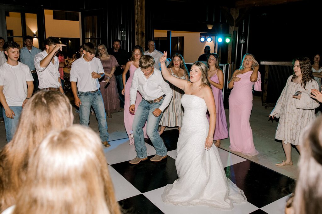 Bride and groom free style dancing. Captured by Mary Wiebe Photography.