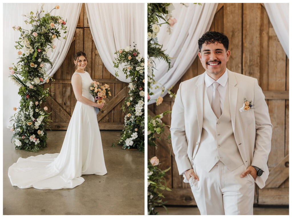 Bride in an ivory wedding gown and groom in a cream suit with peach floral accents at a rustic barn wedding venue