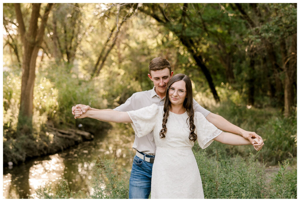 couple do Titanic pose at an Engagement session with Mary Wiebe Photography